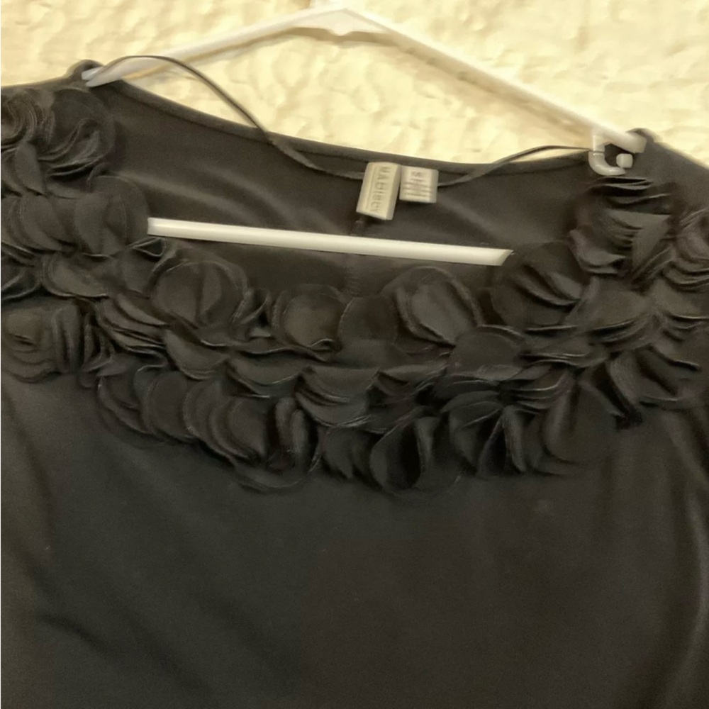 Black dress with ruffle at neckline